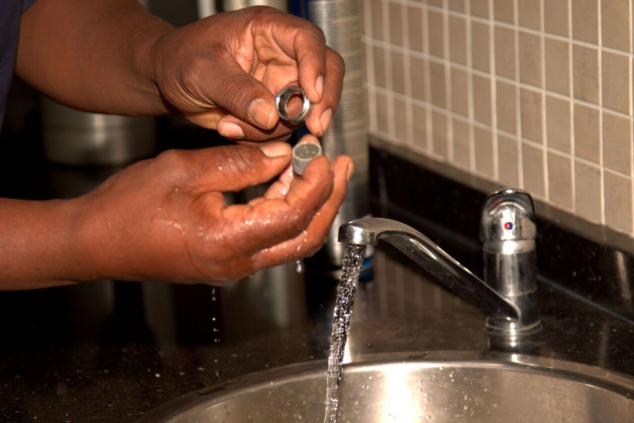 Cleaning a faucet – Alpha Plumbing