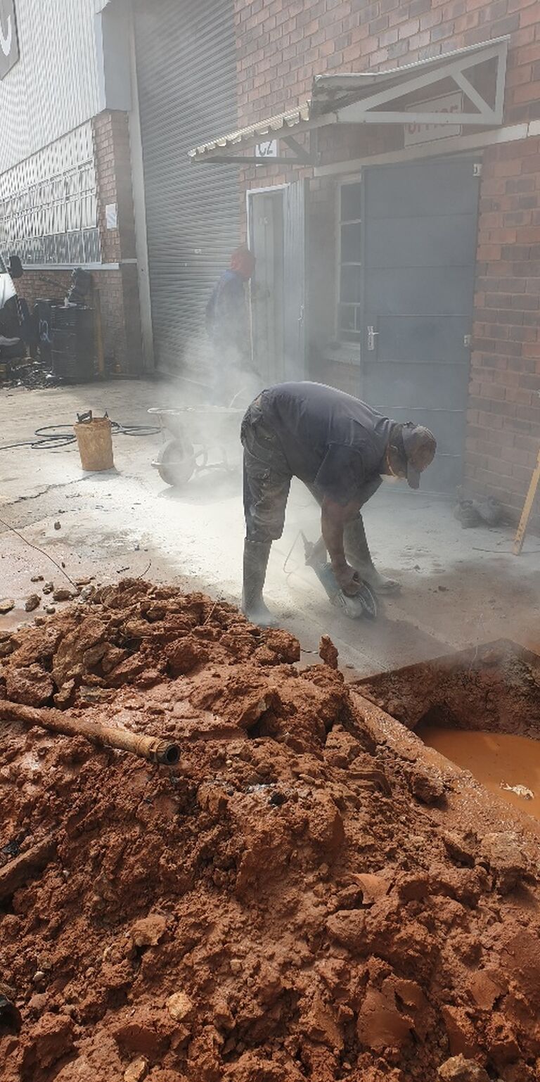 Alpha Plumbing crew conducting a drain repair