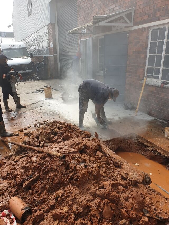 Alpha Plumbing crew conducting a drain repair