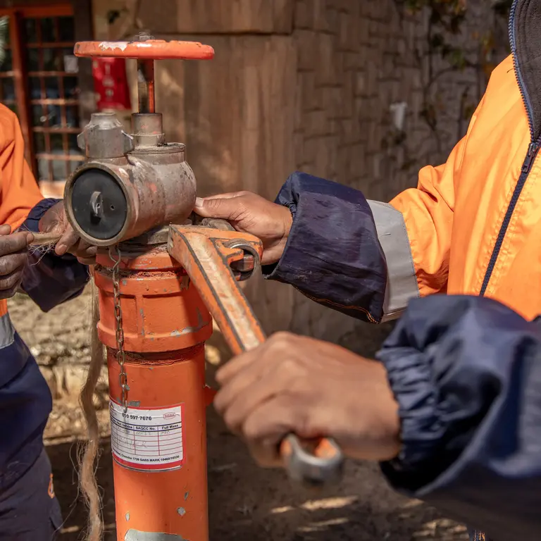 Alpha Plumbing technicians fixing a water valve