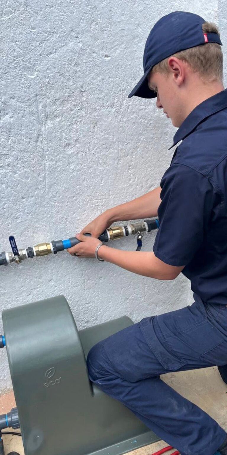 Stefan installing water pump system – Alpha Plumbing