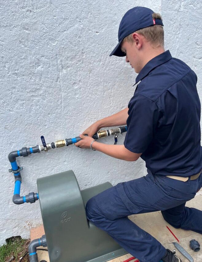 Stefan installing water pump system – Alpha Plumbing